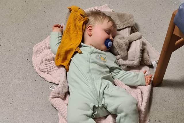 The 10-month-old baby boy sleeps on the floor of Forth Valley Royal Hospital emergency department