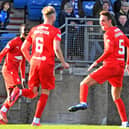 Liam Henderson enjoys rounding off the scoring for Falkirk at Balmoor with teammates Coll Donaldson and Ola Lawal (Pics by Michael Gillen)