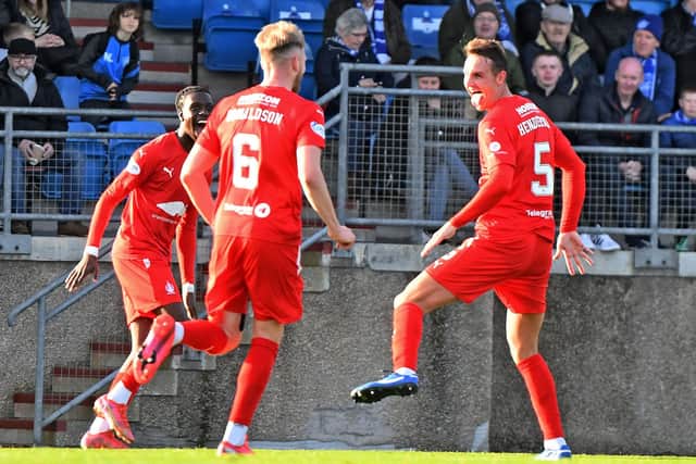 Liam Henderson enjoys rounding off the scoring for Falkirk at Balmoor with teammates Coll Donaldson and Ola Lawal (Pics by Michael Gillen)