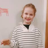 Thea with her award; she was crowned the winner last night.