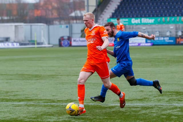 Winger Ian Smith makes his way past his opponent