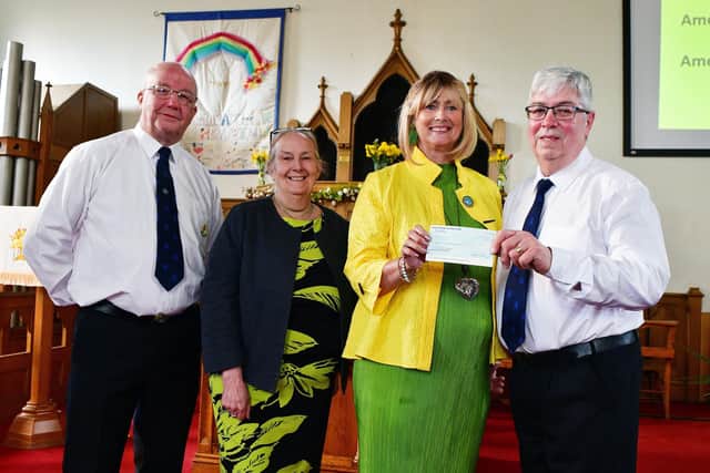 1st Camelon Boys' Brigade donate £1500 to Falkirk Foodbank. Pictured, left to right: Peter Marshall, company lieutenant; Janice Guthrie, Camelon Parish Church; Janice Arbuckle, company captain; and Alastair Blackstock, Falkirk Food Bank chairman. Pic: Michael Gillen