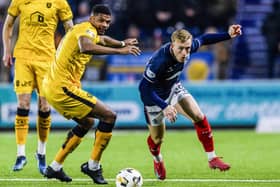 FALKIRK, SCOTLAND - JANUARY 31: Falkirk's Calvin Miller (R) and Livingston's Michael Nottingham in action a William Hill Championship match between Falkirk and Livingston at The Falkirk Stadium, on January 31, 2025, in Falkirk, Scotland, (Photo by Sammy Turner/SNS Group)