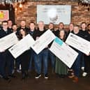 Falkirk Round Table members hand over cheques to charities and groups from cash raised by their Santa sleigh. Pic: Michael Gillen