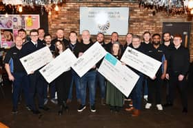 Falkirk Round Table members hand over cheques to charities and groups from cash raised by their Santa sleigh. Pic: Michael Gillen