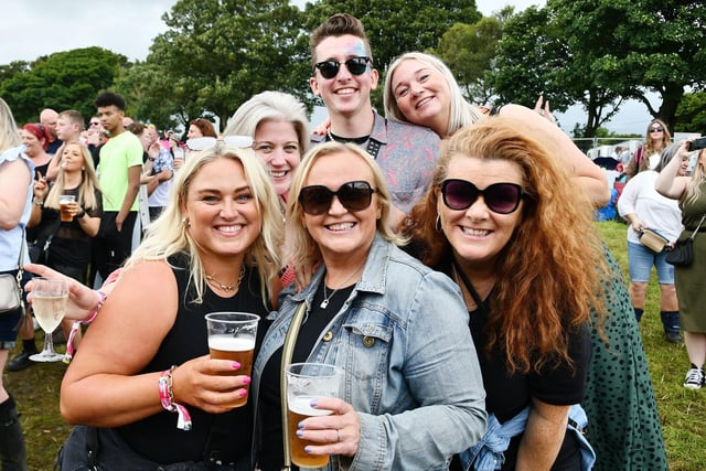 Smiles from these festival goers on Sunday.