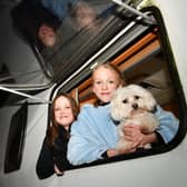 Twins Ayla and Amber Anderson, aged 11, with Bella their four-year-old Maltese dog as the family prepare to spend the night in their motor home as they have a second night of no electricity in Kinnaird. Pic: Michael Gillen