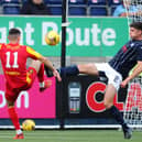 Ryan Williamson goes in for the ball (Pictures by Michael Gillen)