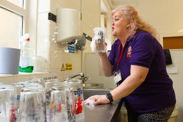 CAMRA Secretary Wendy Ross makes sure the pint glasses are clean