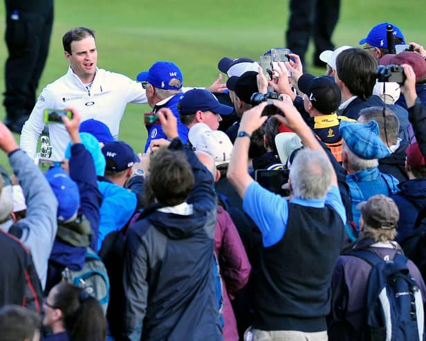 Open winner Zach Johnson takes the acclaim of the St Andrews crowd in 2015. Pic by Michael Gillen