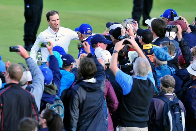 Open winner Zach Johnson takes the acclaim of the St Andrews crowd in 2015. Pic by Michael Gillen