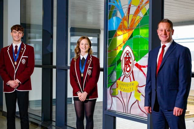 Falkirk High School rector Stuart Kelly with joint Dux prize winners Logan Sibbald and Sarah Coffey. Picture: Scott Louden