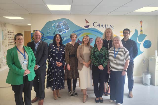 NHS Forth Valley's vice-chair Allan Rennie, second left, and Helena Marshall NHS Forth Valley's head of service for Women and Children’s services, third left, are pictured with Maree Todd, Minister for Mental Wellbeing, fourth right, and NHS Forth Valley CAMHS staff during a visit to Stirling Health and Care Village. Pic: Contributed