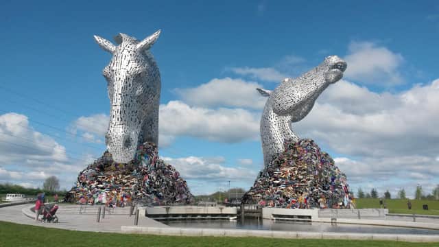 Scotland's 100,000 discarded school uniforms depicted next to the Kelpies.