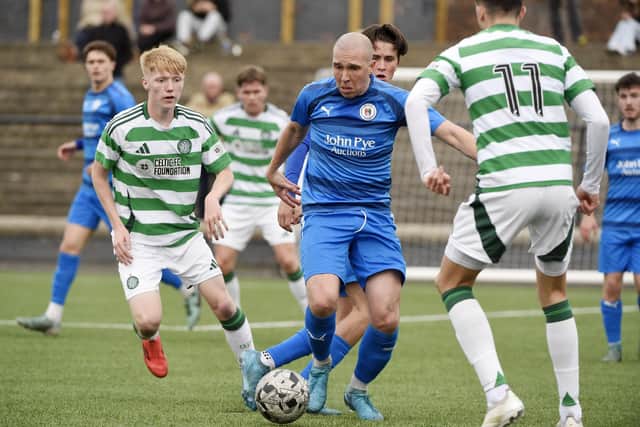 Bo'ness United's Michael Gemmell gets stuck in against Celtic B (Pic Alan Murray)