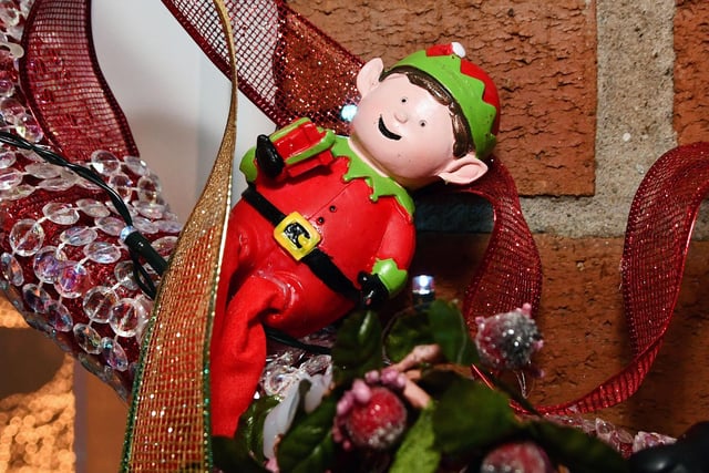 An elf, temporarily blinded by the Miller Lights Display, struggles to find his way to Santa's workshop
