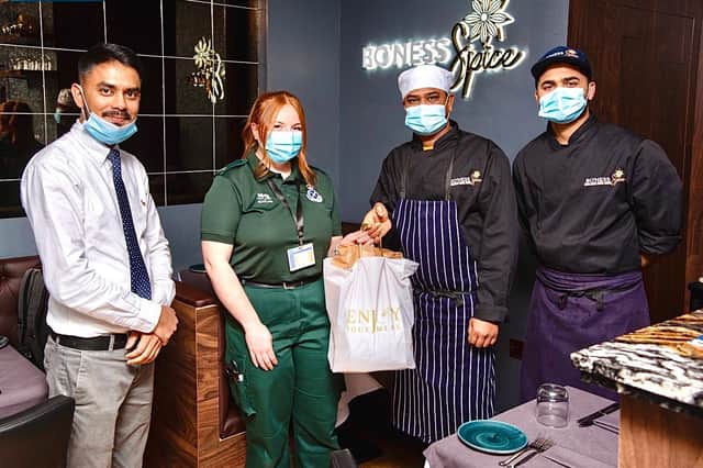 Bo’ness Spice's Mohammad Abbas (on the left) with Ambulance Technician Trainee Megan Aitken and Bo’ness Spice chefs Forhad Miah (far right) and Prince Morol.