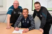 Tom Lang signs new deal with Falkirk until June 2027 in the company of manager John McGlynn and his assistant Paul Smith (Pics by Michael Gillen)
