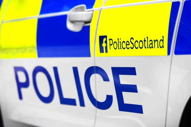 John Devlin. Stock shot of Police Scotland car.