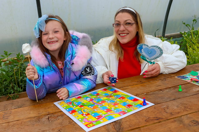 Crystal (7) and her mum Michelle play snakes and ladders at the event hosted by Sustainable Thinking Scotland.