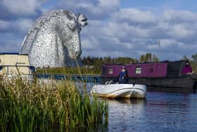 Scottish Canals activities assistant Rebecca Brown provides instruction to people hiring the electric boats. Pic: Lisa Ferguson