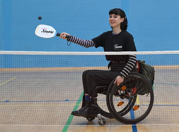 Abby Cook (19) serves up a new initiative to help improve people's physical and mental health
