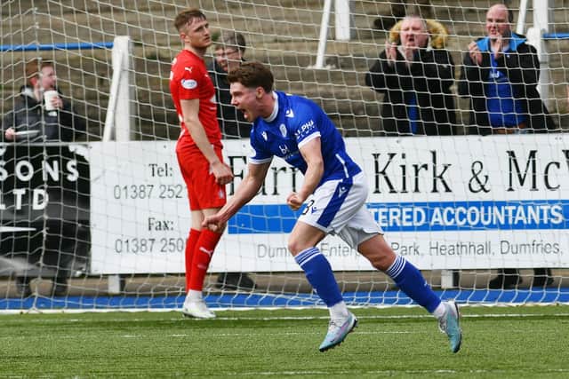 Kieran McKechnie celebrates after his shot at goal helped Queen of the South take the lead