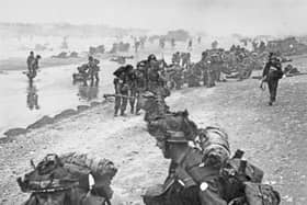 Allied troops from the 8th Brigade, 3rd Infantry Division of the British Second Army come ashore on Queen Red beach, Sword Beach area from Landing Craft Infantry (LCI) on the morning of D-Day during Operation Overlord.  Pic: Getty Images