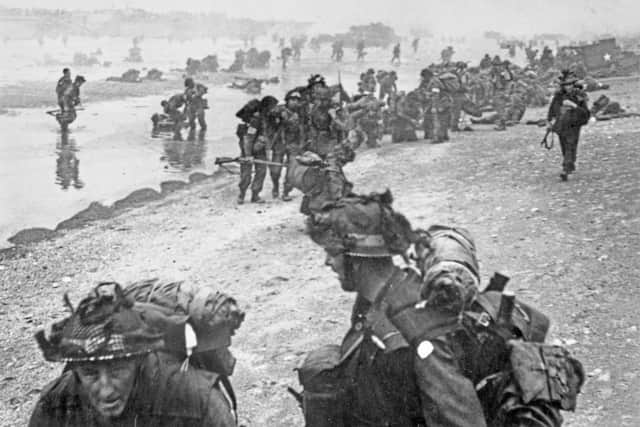 Allied troops from the 8th Brigade, 3rd Infantry Division of the British Second Army come ashore on Queen Red beach, Sword Beach area from Landing Craft Infantry (LCI) on the morning of D-Day during Operation Overlord. Pic: Getty Images