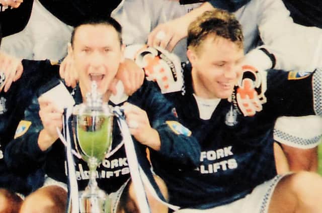 Jamie McGowan (left) lifted the cup after a goal form David Hagen (right)