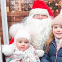Mirryn, 5, and Maya, 1, were among those to meet Santa on Tuesday.
