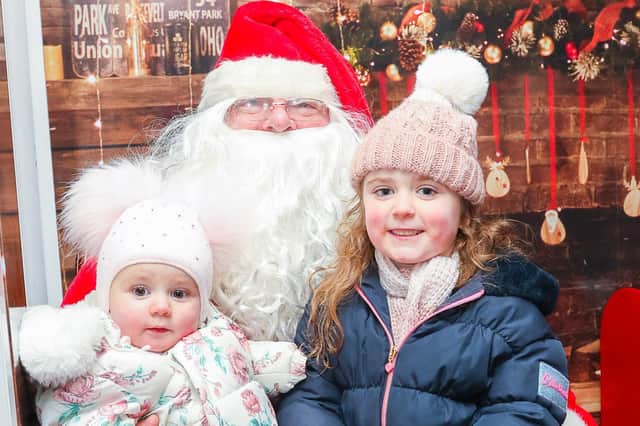 Mirryn, 5, and Maya, 1, were among those to meet Santa on Tuesday.