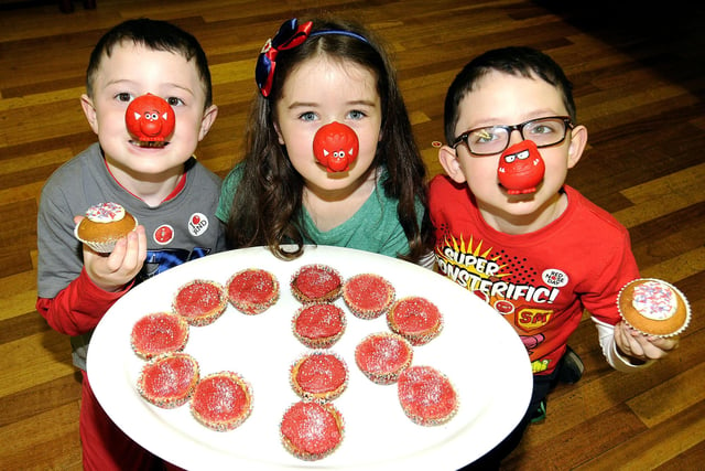 With cakes arranged in a CR pattern are left to right cousins Kieran MacGregor (6), Ellie McLeod (9) and Jon Paul MacGregor (7), at the Project Theatre fundraiser in 2013.