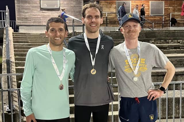 Gold medallist and Falkirk Vics star Scott Stirling with podium-placed Taha Gharfari of Shettleston Harriers and Logan Rees of Fife AC after the 10,000m event (Photo: Scottish Athletics)