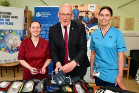 Announcing the extra funding at Falkirk Community Hospital, First Minister John Swinney met NHS staff Louise Kirby, lead advanced nurse practitioner, left, and Karen Laird, clinical lead physiotherapist. Pic: Michael Gillen