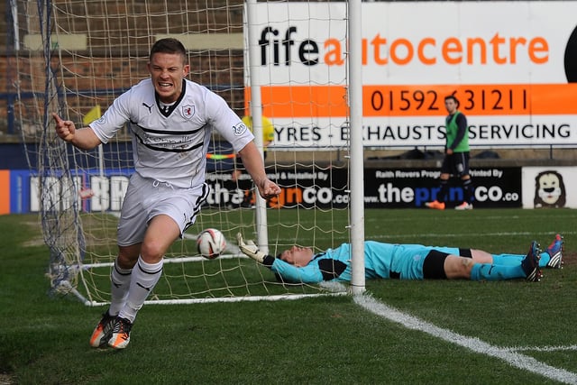 John Baird celebrates scoring leaving keeper Michael McGovern prostrate on the ground