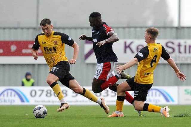 Falkirk winger Alfredo Agyeman is fouled by Annan Athletic's Dominic Docherty (Photo: Michael Gillen)