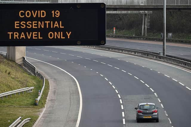 A motorway sign on the M8 advising on essential travel only (Photo: Jeff J Mitchell/Getty Images)