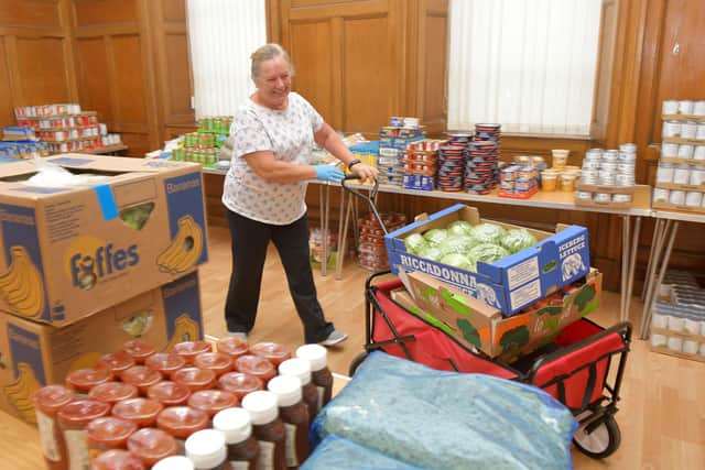 Keeping Larbert and Stenhousemuir Beautiful volunteers have received funding through Stenhousemuir FC's community helpline initiative to help with its KLSB Pantry. Shirley Walsh volunteer.