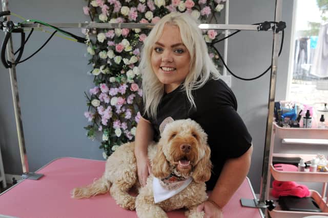 Larbert woman Carlynn Lees, pictured with Cockapoo Bertie, has started up her own dog grooming service following 17 years spent in the finance industry. Picture: Michael Gillen.