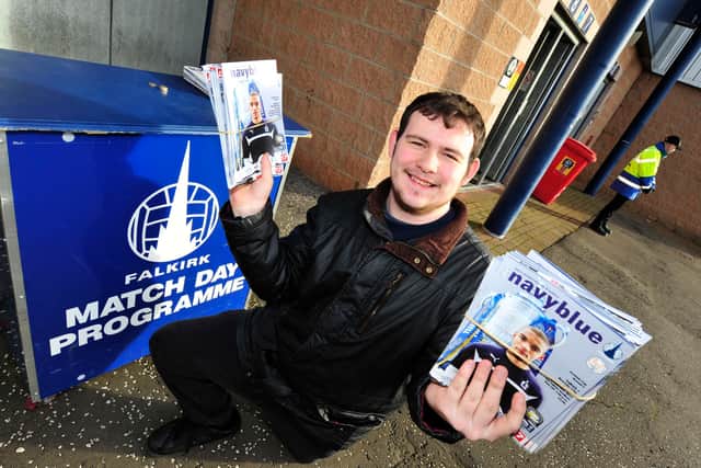 Programme Seller Damien Dewar with copies of the programme outside the main stand. Pic by Alan Murray