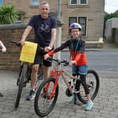 Lewis Baird and dad Colin cycled 85 miles in eight days for Strathcarron Hospice. Sister Stella Baird also cycled ten miles to add to the £755 total. Picture: Michael Gillen.