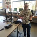 Ross McGeever, a mechanical technician from Forth Valley College, with some of the plastic visors made using the 3D printers