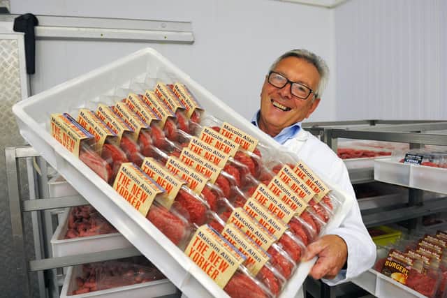Malcolm Allan director Gordon Allan shows off just some of the record breaking 161,000 burgers which the company produced over the course of one week