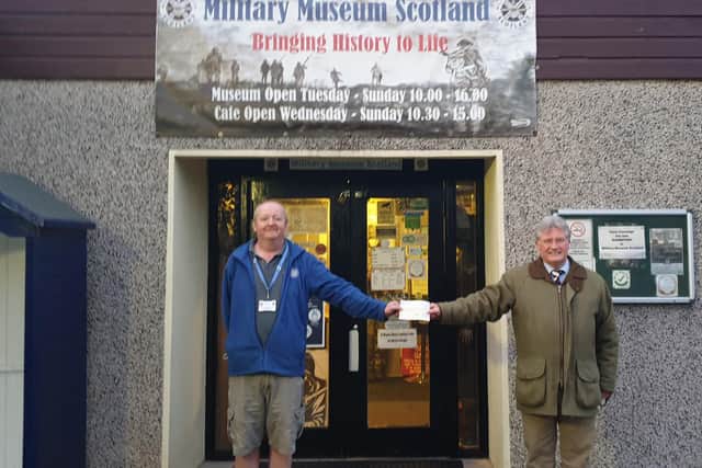 The Military Museum Scotland based at Linburn received a donation. The photograph shows vice chairman Atholl McInnes CStJ presenting a cheque to Ian Inglis Museum Curator.