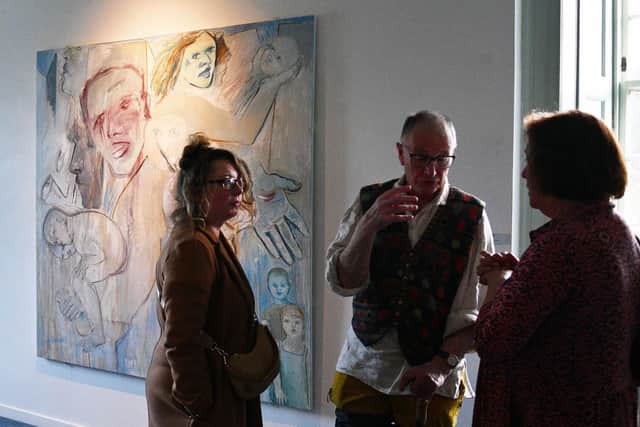 Visitors discussing the exhibition. Pic: Michael Gillen