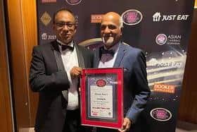 Ram Salhotra (right), owner of Bainsford Indian Masala Ram's, smiles alongside Yawar Khan. chairman of the Asian Catering Federation, after the eatery was again named Best Asian Restaurant Stirlingshire in the Scotland Asian Restaurant Awards. Contributed.