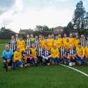 The teams - Santa's Superstars and Cammy's Legends - before the match.