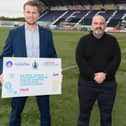 Jamie Swinney, left, and Derek Allison, right, declaring their support for the charter at the Falkirk Stadium on Sunday, accompanied by Robert Nesbitt (Photo: Ian Sneddon)