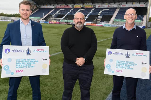 Jamie Swinney, left, and Derek Allison, right, declaring their support for the charter at the Falkirk Stadium on Sunday, accompanied by Robert Nesbitt (Photo: Ian Sneddon)